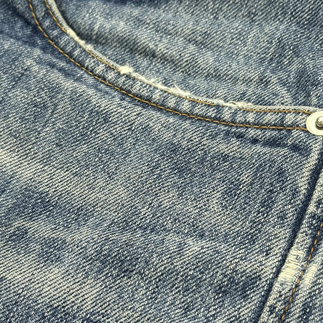 Washed denim, distressing and stitch detail