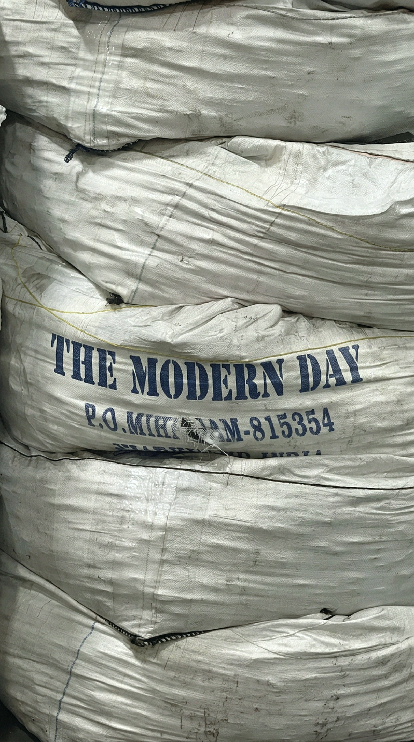 THE MODERN DAY printed on a bale of cloth, in transit